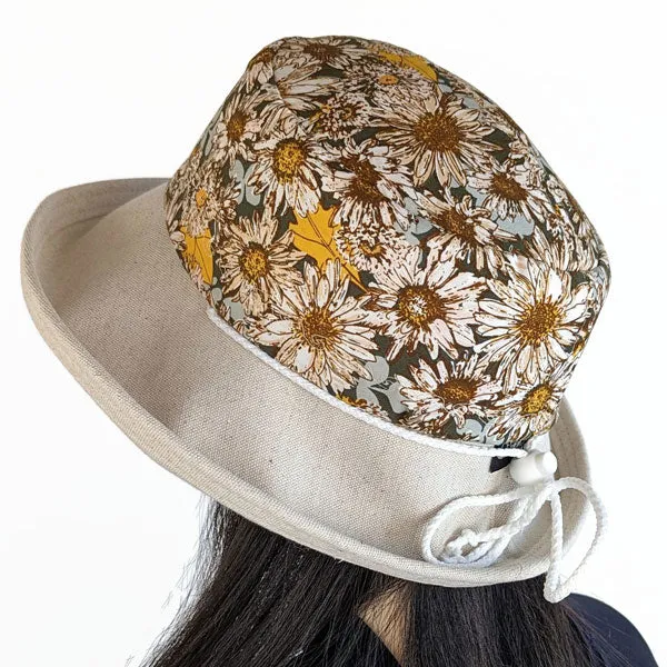 115-a Sunblocker UV summer hat with large wide brim featuring sunflowers print in earth tones