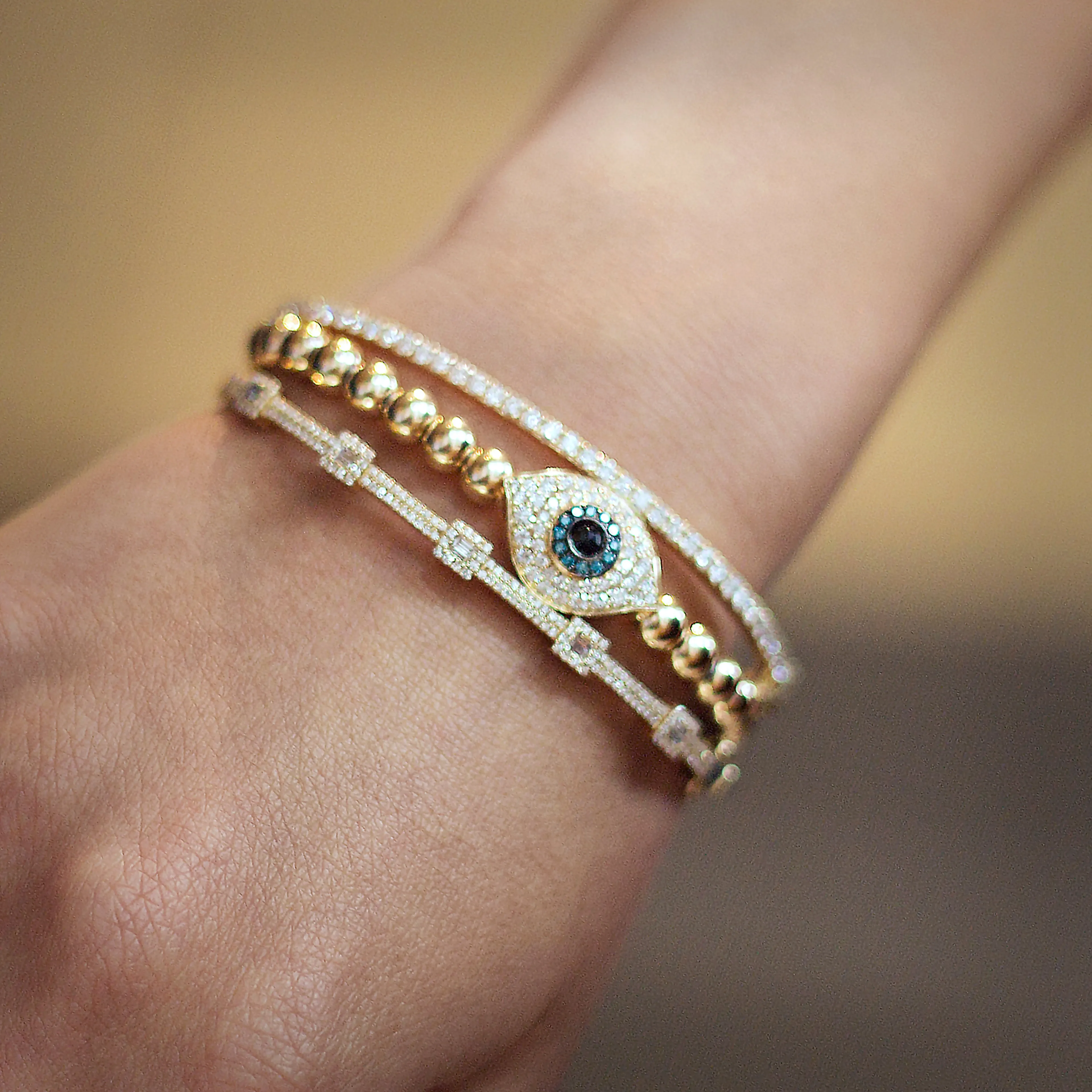 14KT GOLD DIAMOND EVIL EYE BALL STRETCH BRACELET