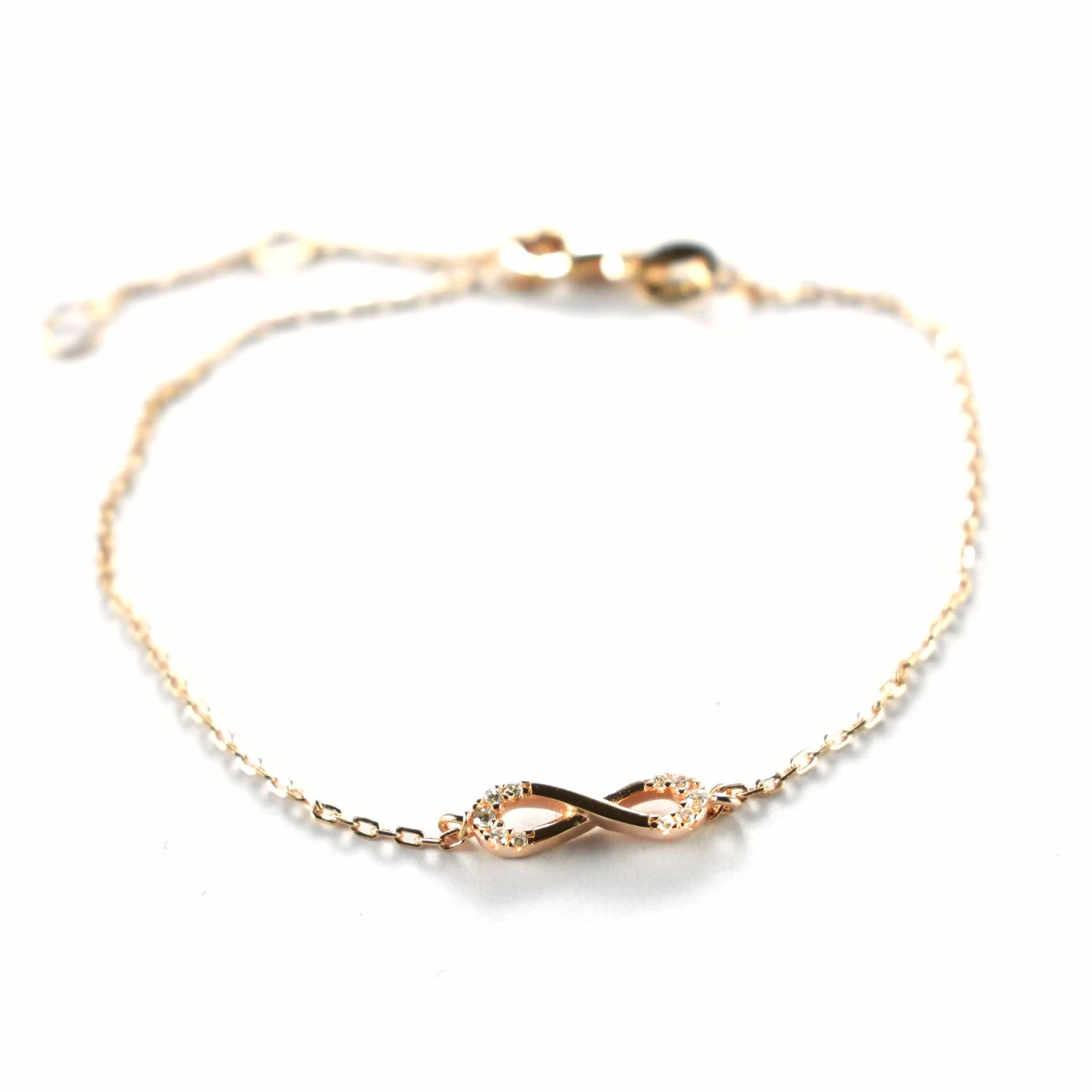 Bow pattern silver bracelet with white CZ & pink gold plating