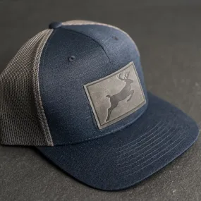 Leather Patch Performance Style Trucker Hat - Deer Stamp